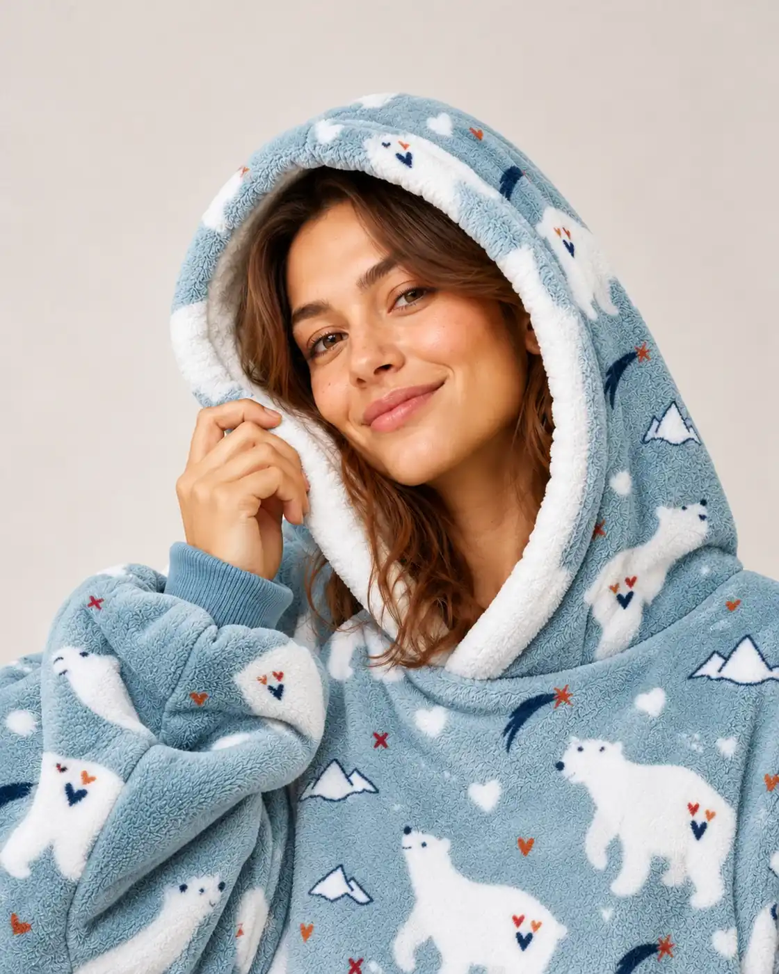 Close-up of a smiling woman with the white-lined hood of the Polar Bear Moffli
