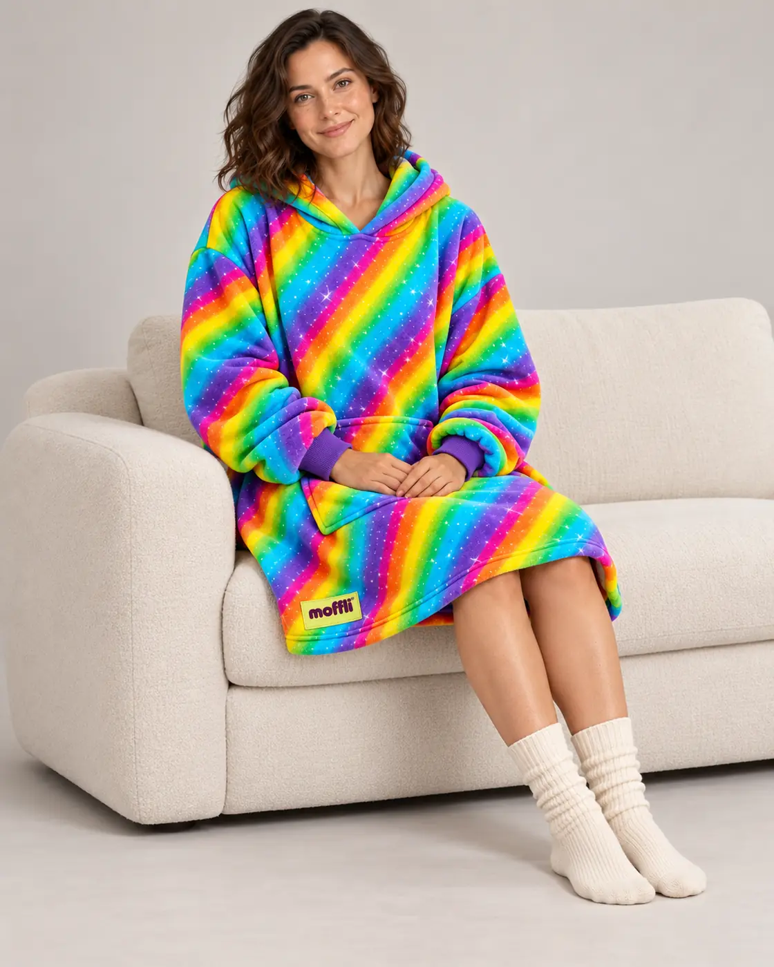 Smiling woman with the white-lined hood of the Rainbow Moffli up