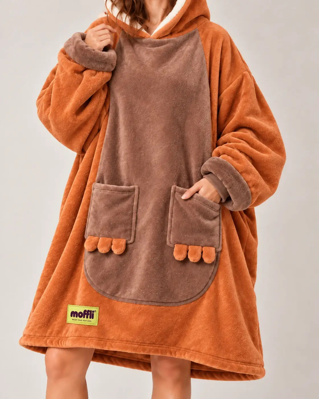 Front detail of the Capybara Moffli with brown panel, orange paw pockets and Moffli label