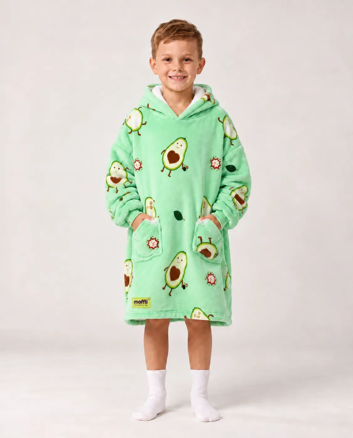 Boy standing wearing the mint green Avocado Love Kids Moffli, hands in pockets
