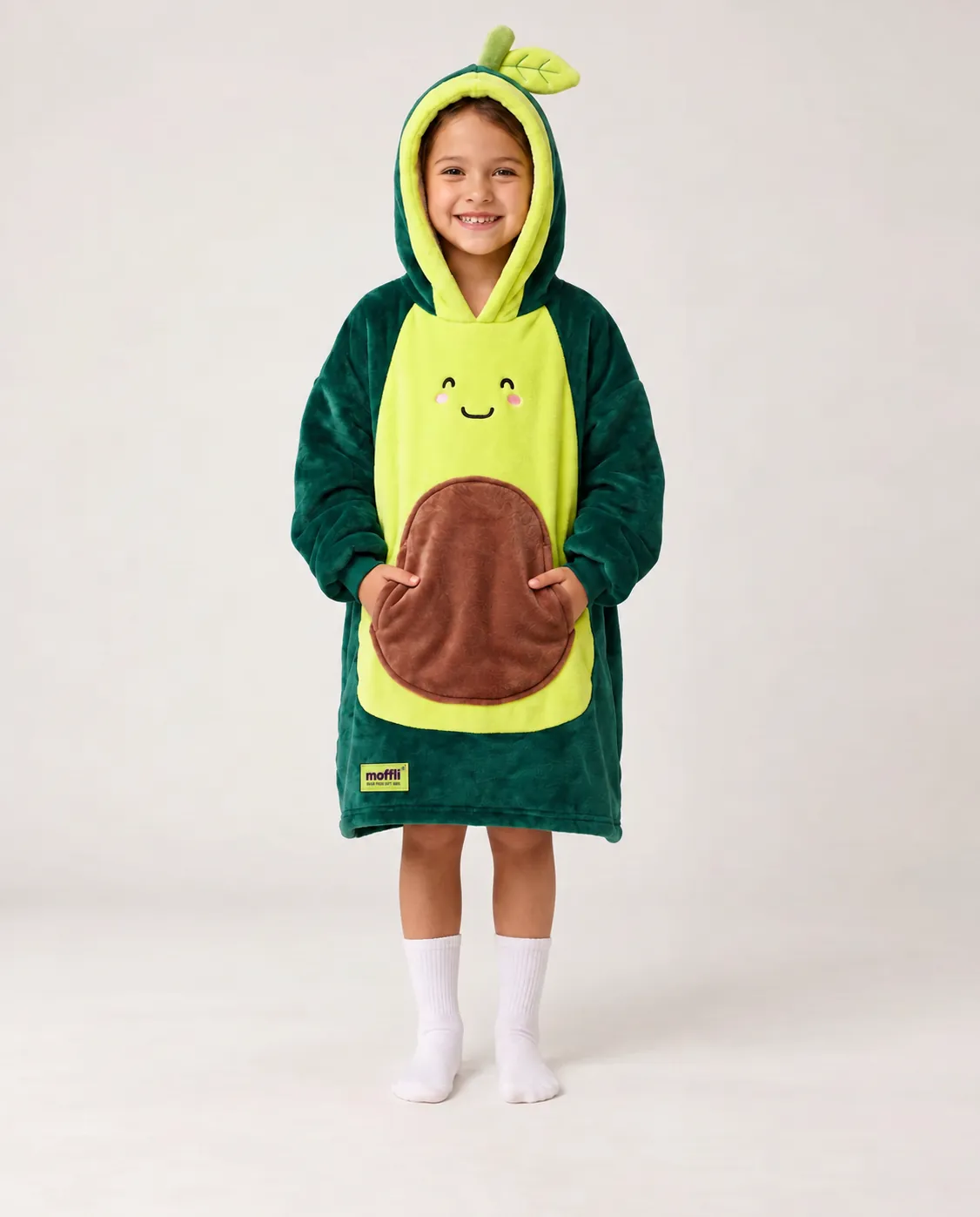 Girl standing wearing the Avocado Kids Moffli, leafy hood up and hands in pocket