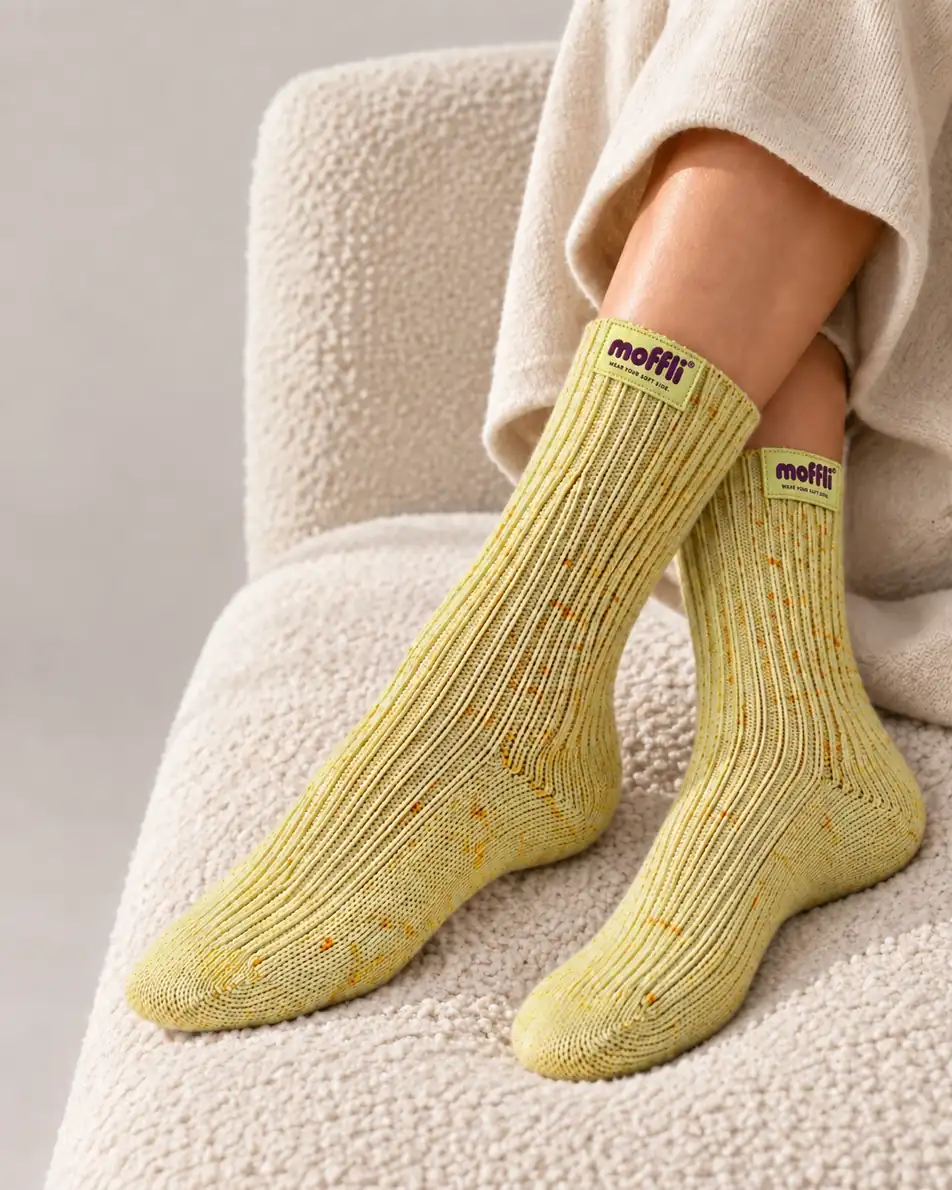 Lifestyle of MOFFLI Cosy Socks Butter Yellow on armchair