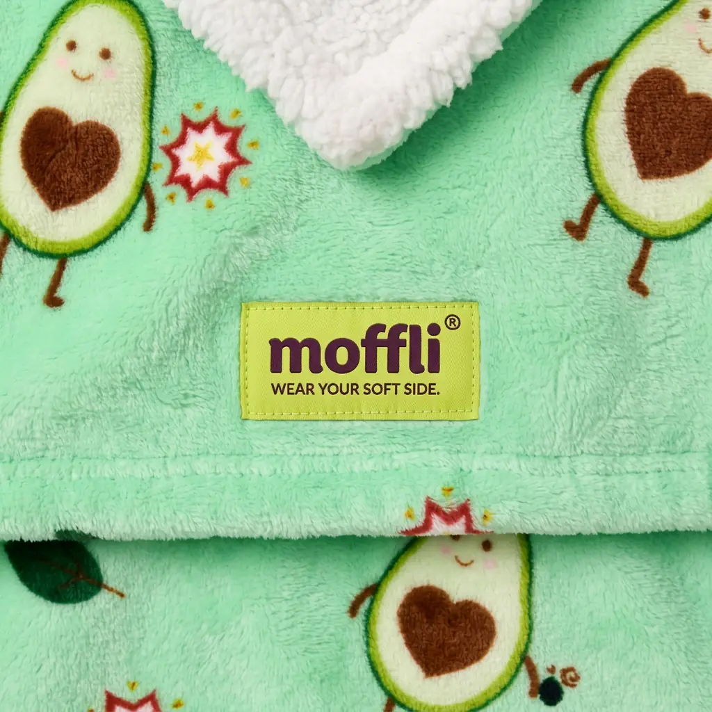 Detail of the mint green fabric of the Avocado Love Kids Moffli with Moffli label and sherpa lining